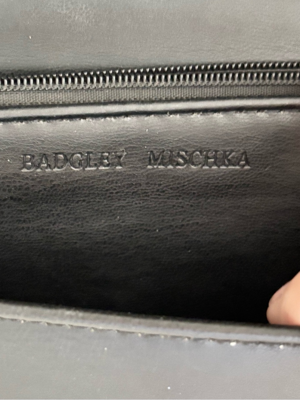Badgley Mischka woman’s Black Leather Wallet with Embossed Logo. Never used